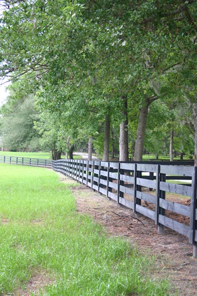 fencing 017_cynthia_mcfarland A gambrel roofed red barn.