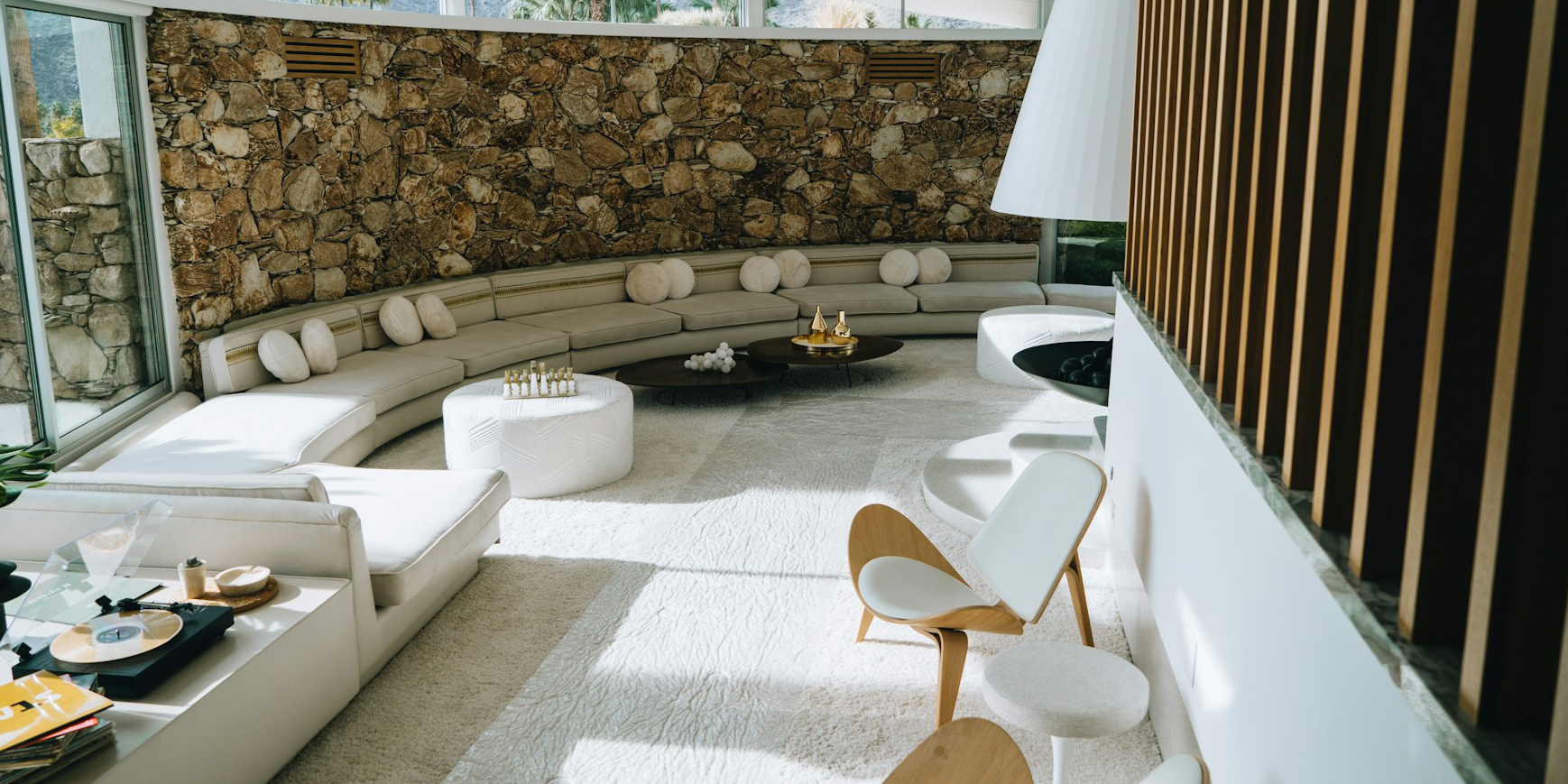 peter-thomas-sb016IIptNw-unsplash Mid Century Modern home with curved stone wall and built-in seating area